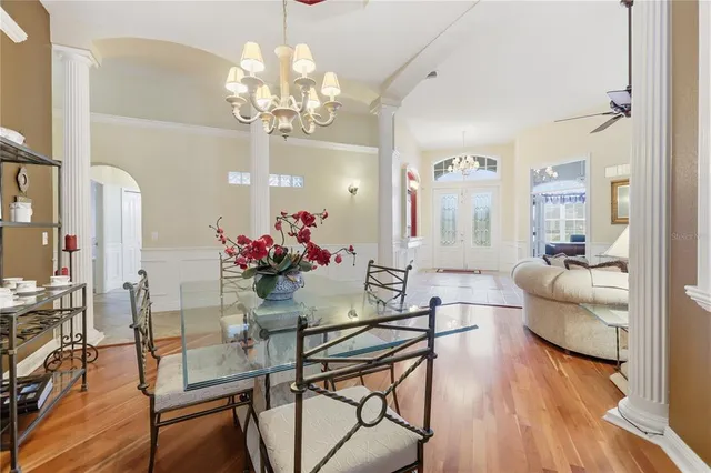 a view of a dining room with furniture and wooden floor