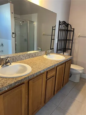 a bathroom with a shower and toilet