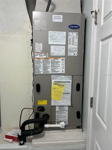 a view of a backyard with wooden fence and a bench