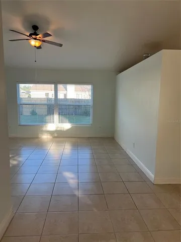 a view of a livingroom with a fireplace and window