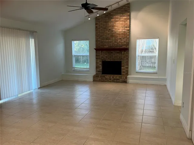 a kitchen with stainless steel appliances granite countertop a refrigerator a sink and a stove