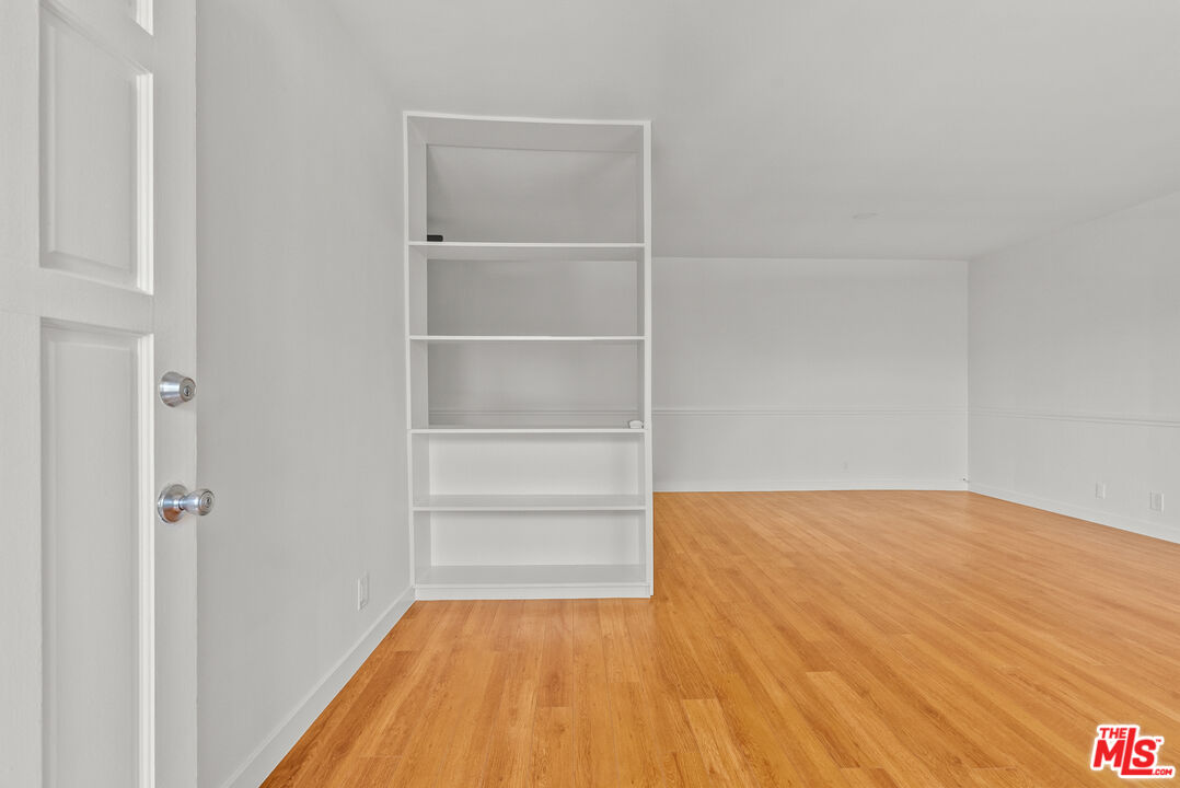 272 South Doheny Drive, Unit 1 Beverly Hills, CA 90211 - Photo 16 of 44 a view of a room with wooden floor