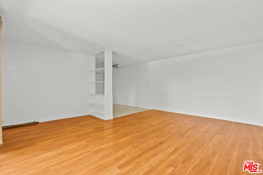 272 South Doheny Drive, Unit 1 Beverly Hills, CA 90211 - Photo 18 of 44 a view of empty room with wooden floor