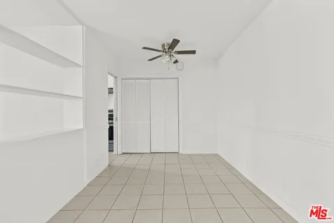 a view of a livingroom with wooden floor and white doors