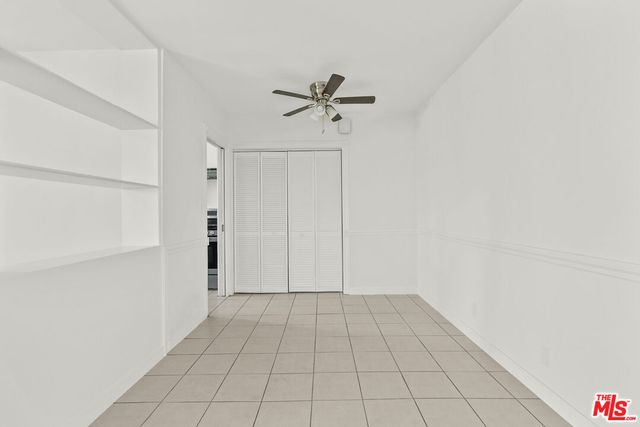 a view of a livingroom with wooden floor and white doors