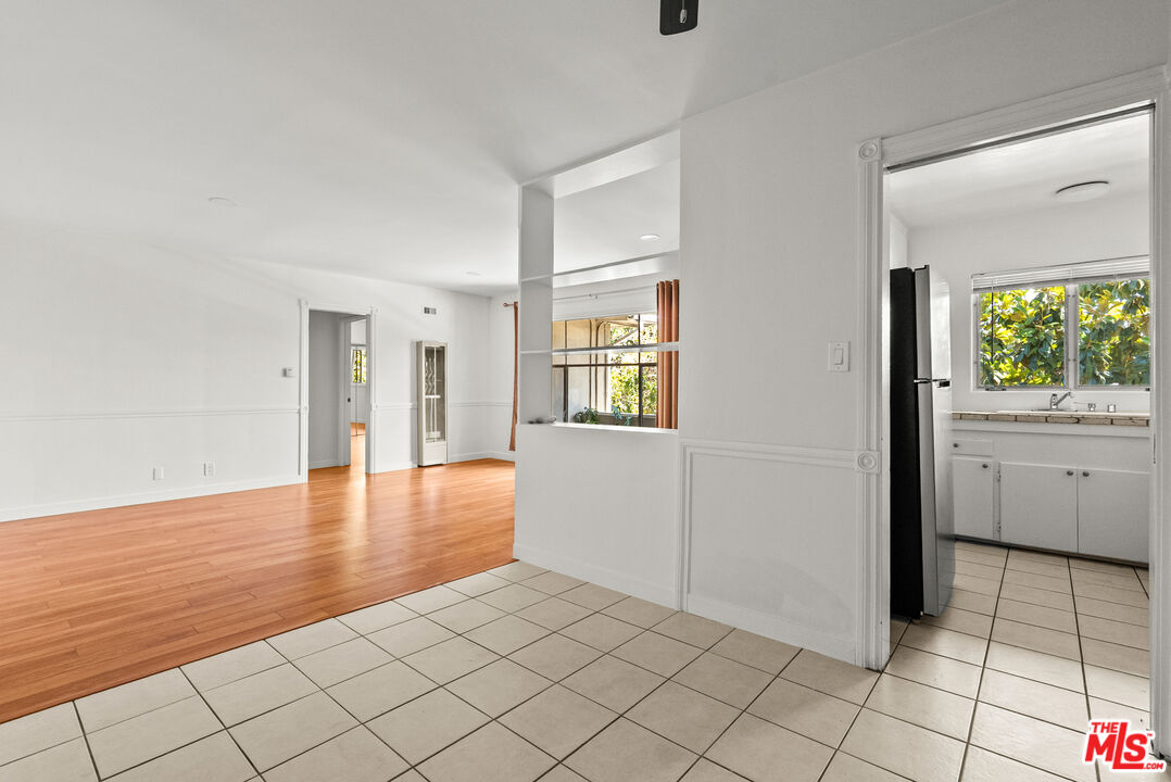 272 South Doheny Drive, Unit 1 Beverly Hills, CA 90211 - Photo 20 of 44 a view of a livingroom with wooden floor and white doors
