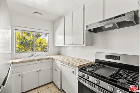 a kitchen with a sink and a window
