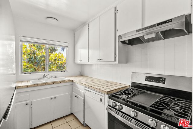 a kitchen with a sink and a window