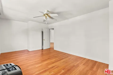 a view of hallway with wooden floor