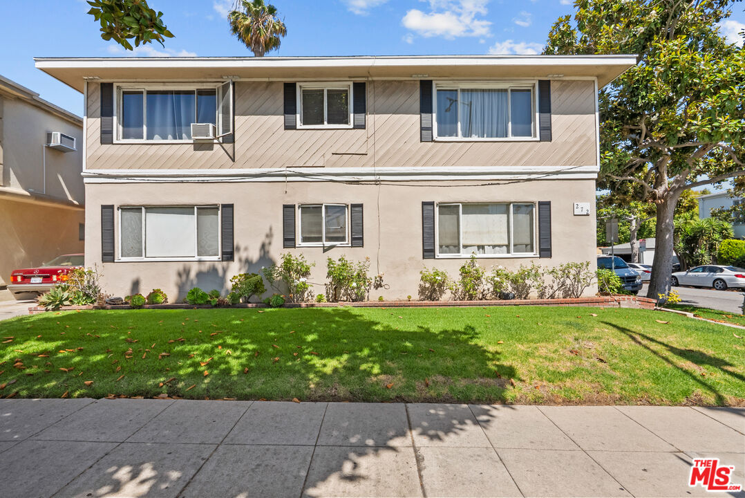 272 South Doheny Drive, Unit 1 Beverly Hills, CA 90211 - Photo 3 of 44 a front view of a house with a yard