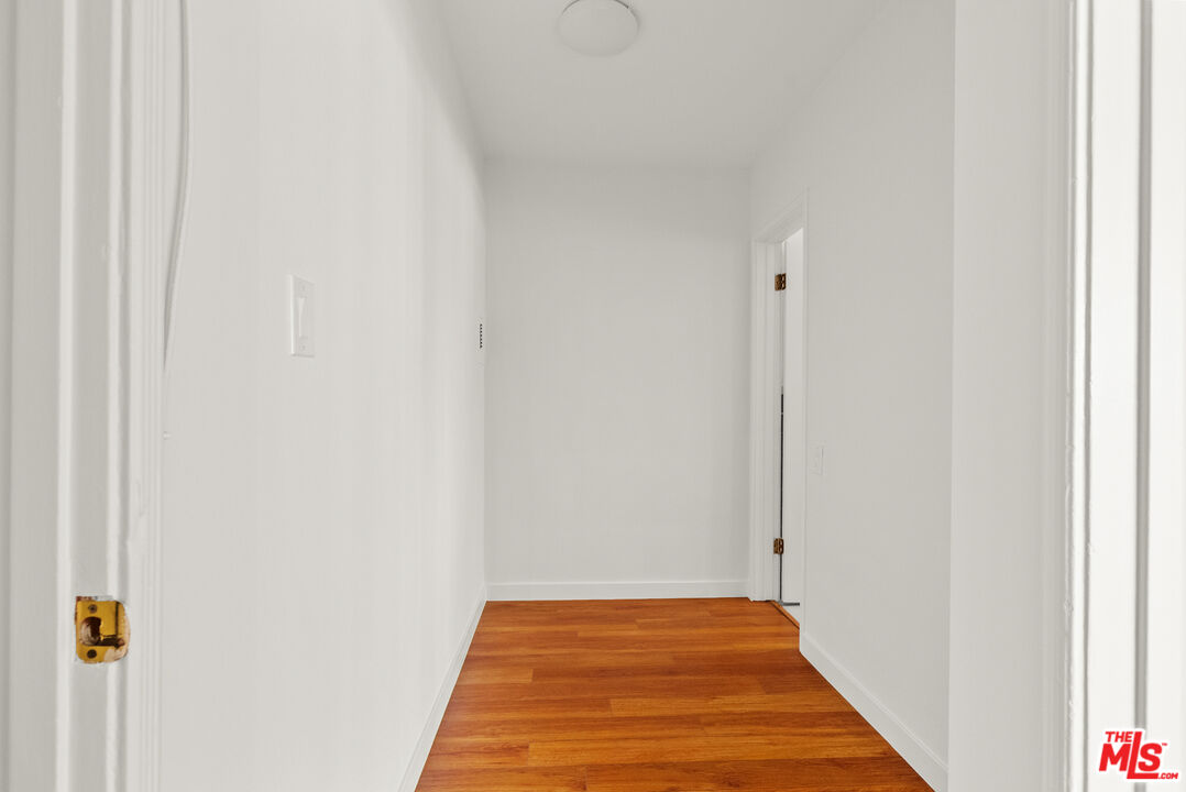272 South Doheny Drive, Unit 1 Beverly Hills, CA 90211 - Photo 35 of 44 a view of a hallway with wooden floor