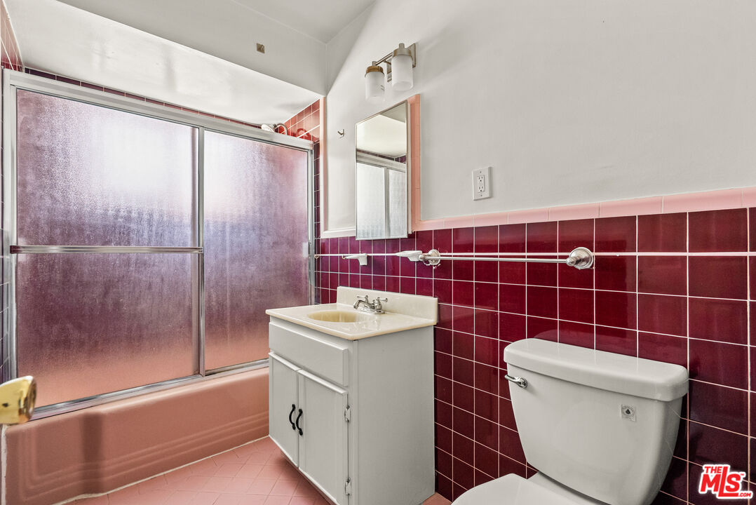 272 South Doheny Drive, Unit 1 Beverly Hills, CA 90211 - Photo 36 of 44 a bathroom with a toilet sink and shower