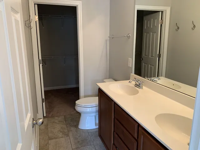 a bathroom with a sink toilet and vanity