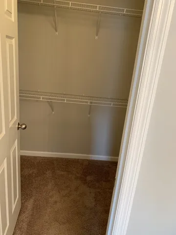 a bathroom with a light fixture a sink and a mirror