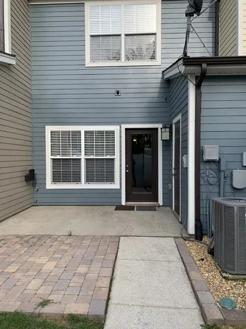 a view of a car parked in front of a house