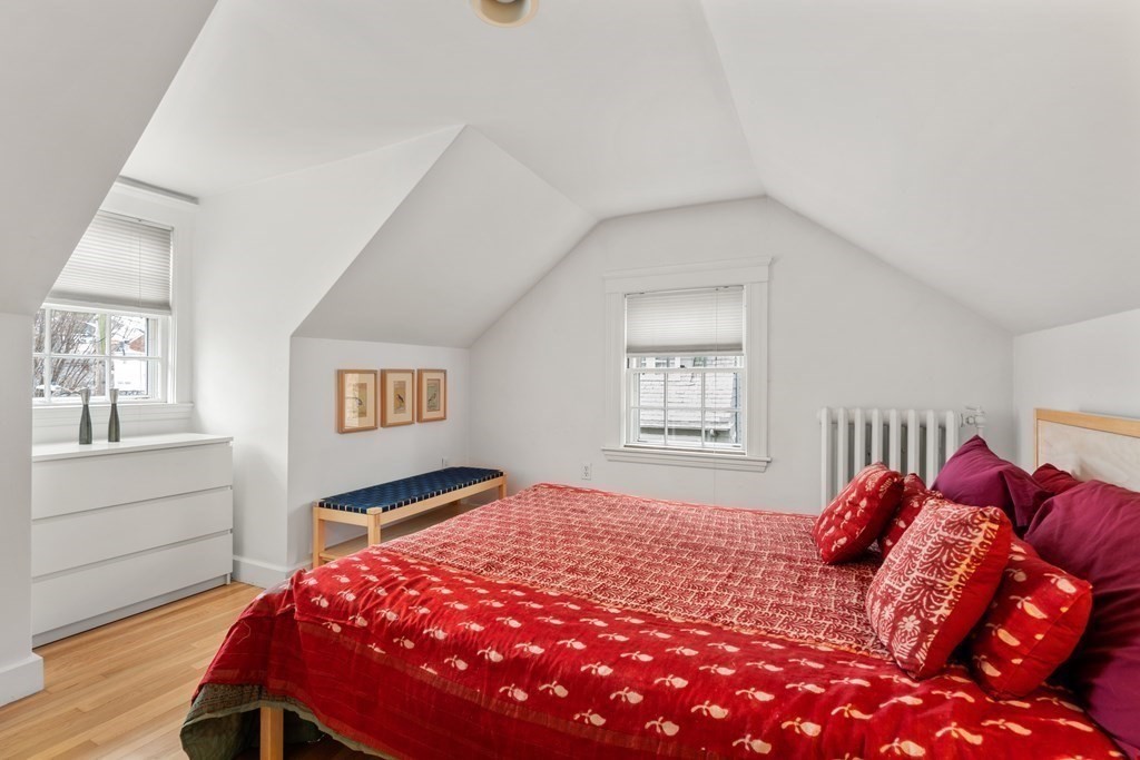 85 Stanton Road Brookline, MA 02445 - Photo 24 of 38 a bedroom with a bed and wooden floor