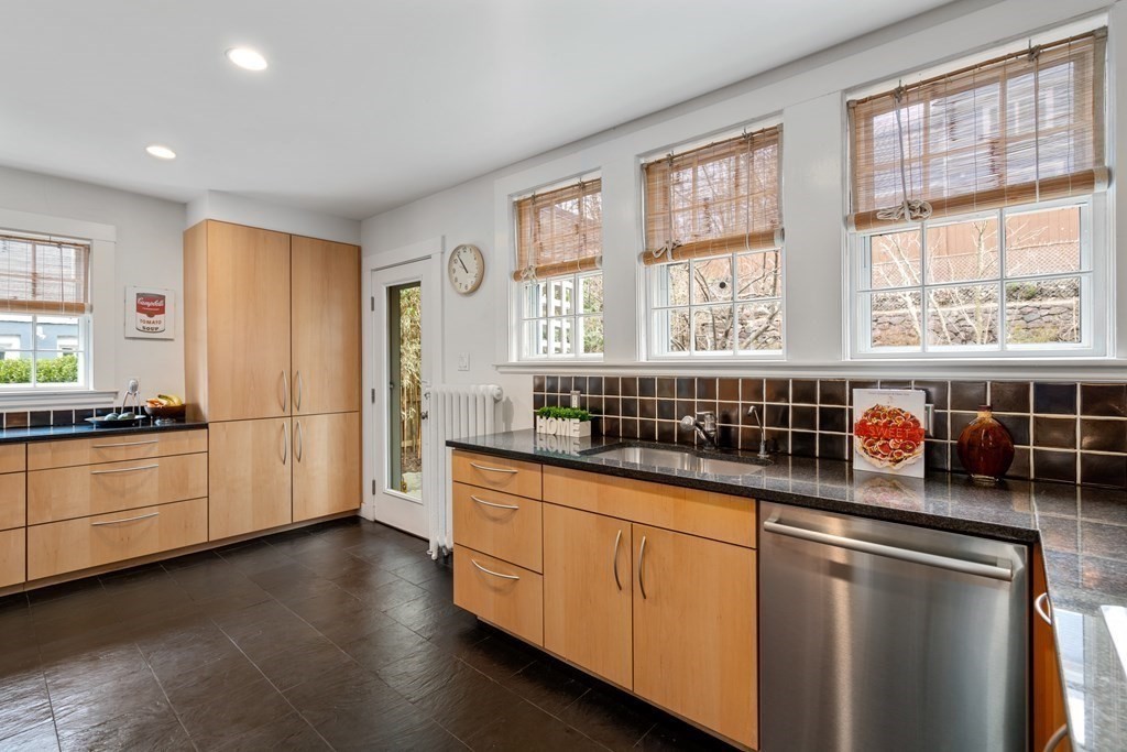 85 Stanton Road Brookline, MA 02445 - Photo 4 of 38 a kitchen with stainless steel appliances a sink and a window