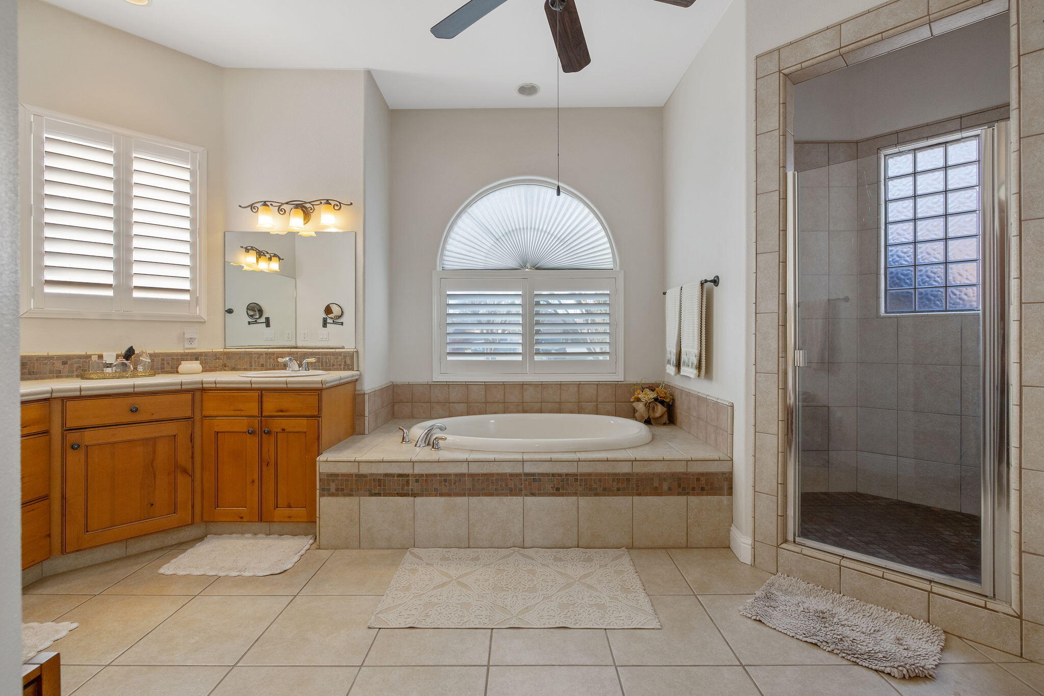 729 St Thomas Court Exeter, CA 93221 - Photo 32 of 66 a spacious bathroom with a tub sink and mirror