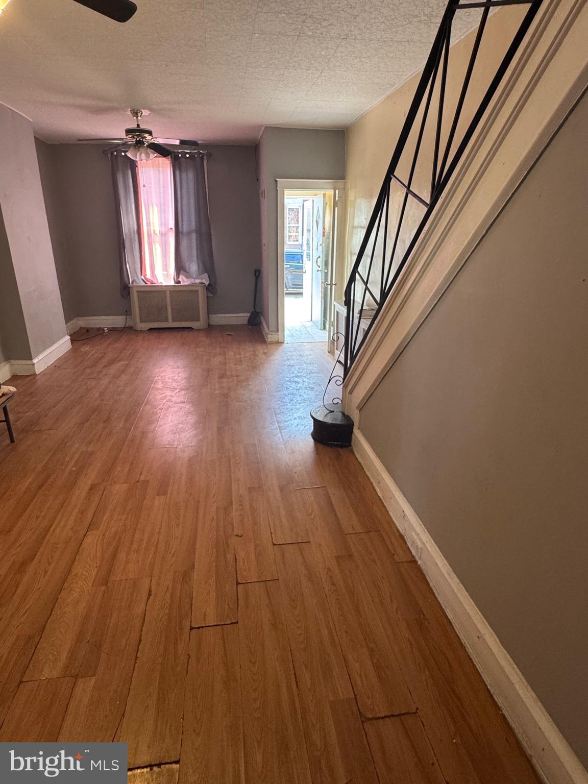 3044 Rorer Street Philadelphia, PA 19134 - Photo 2 of 7 wooden floor in an empty room with a window