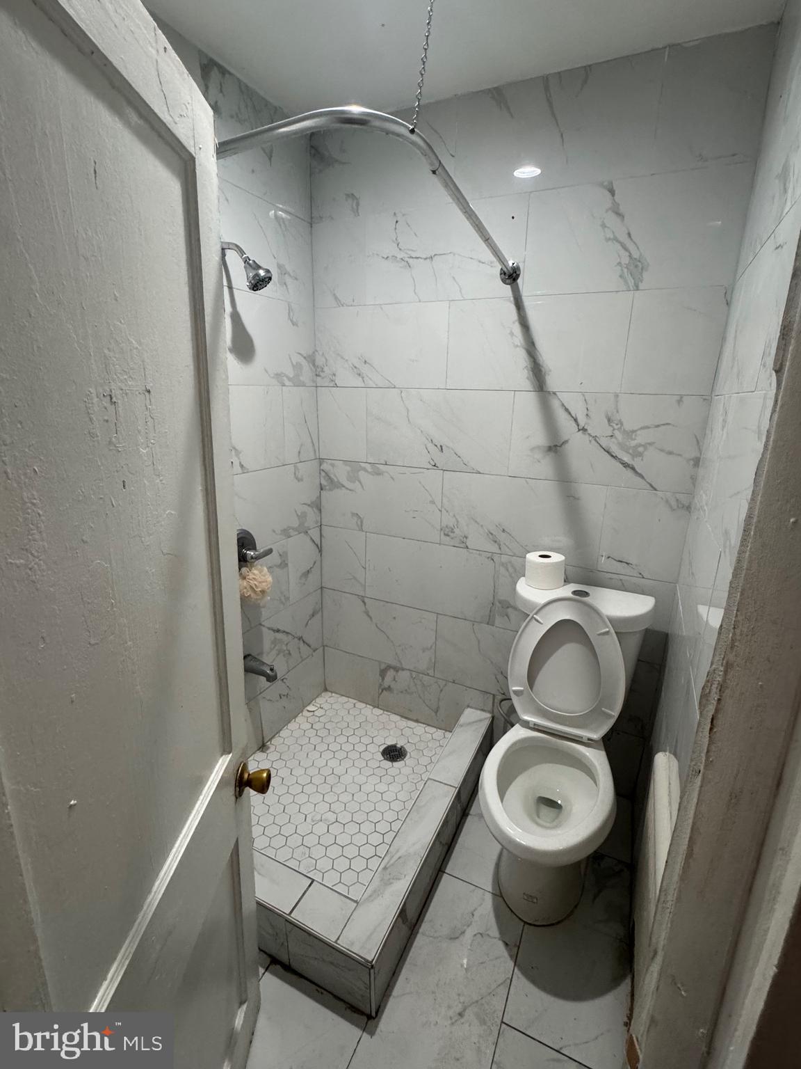 3044 Rorer Street Philadelphia, PA 19134 - Photo 7 of 7 a bathroom with a toilet and a shower