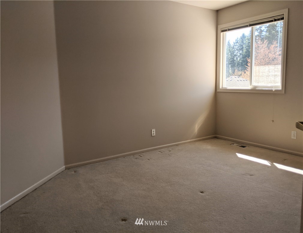 3016 214th Street Southeast Bothell, WA 98021 - Photo 15 of 25 an empty room with a window