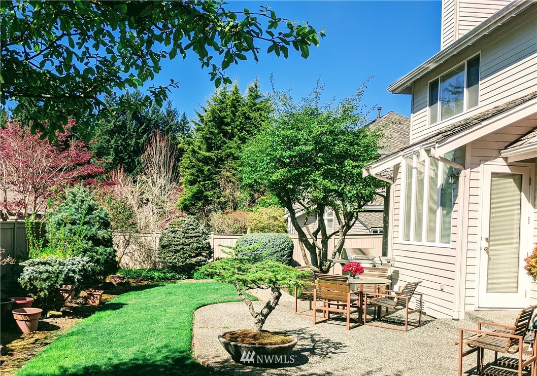 3016 214th Street Southeast Bothell, WA 98021 - Photo 19 of 25 a view of a backyard with sitting area and garden