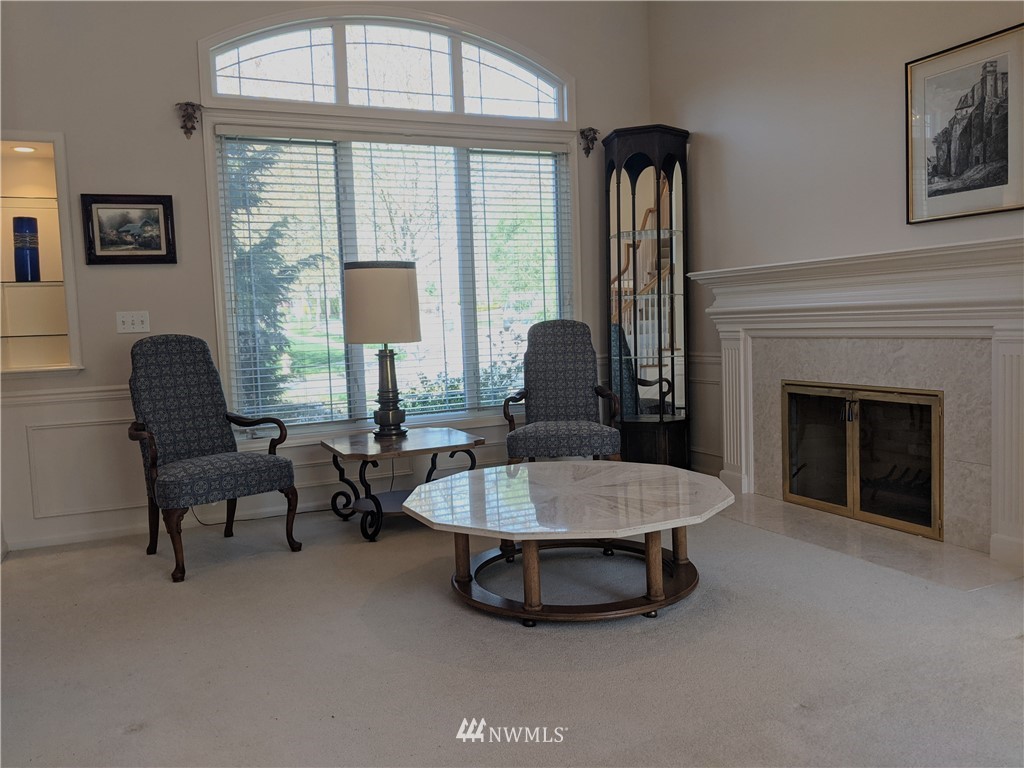 3016 214th Street Southeast Bothell, WA 98021 - Photo 3 of 25 a living room with furniture and a fireplace