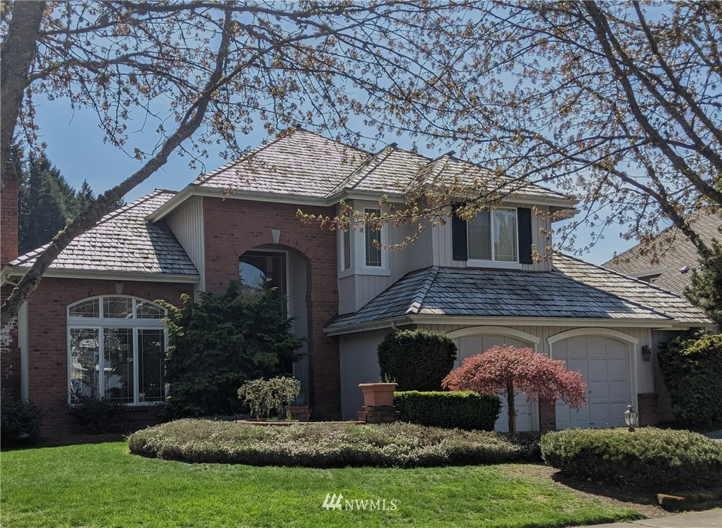 3016 214th Street Southeast Bothell, WA 98021 - Photo 24 of 25 a front view of a house with a garden