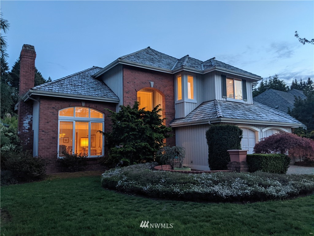 3016 214th Street Southeast Bothell, WA 98021 - Photo 25 of 25 a front view of a house with a garden