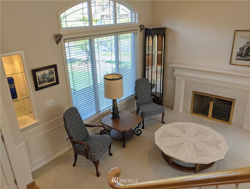 3016 214th Street Southeast Bothell, WA 98021 - Photo 4 of 25 a living room with furniture and a fireplace