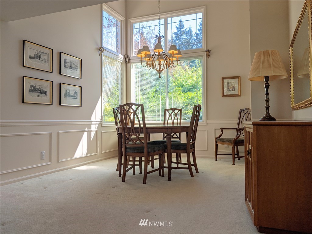 3016 214th Street Southeast Bothell, WA 98021 - Photo 5 of 25 a view of a dining room with furniture window and outside view