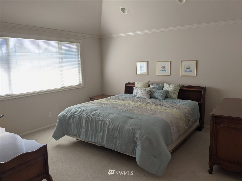 3016 214th Street Southeast Bothell, WA 98021 - Photo 9 of 25 a bedroom with a bed and window