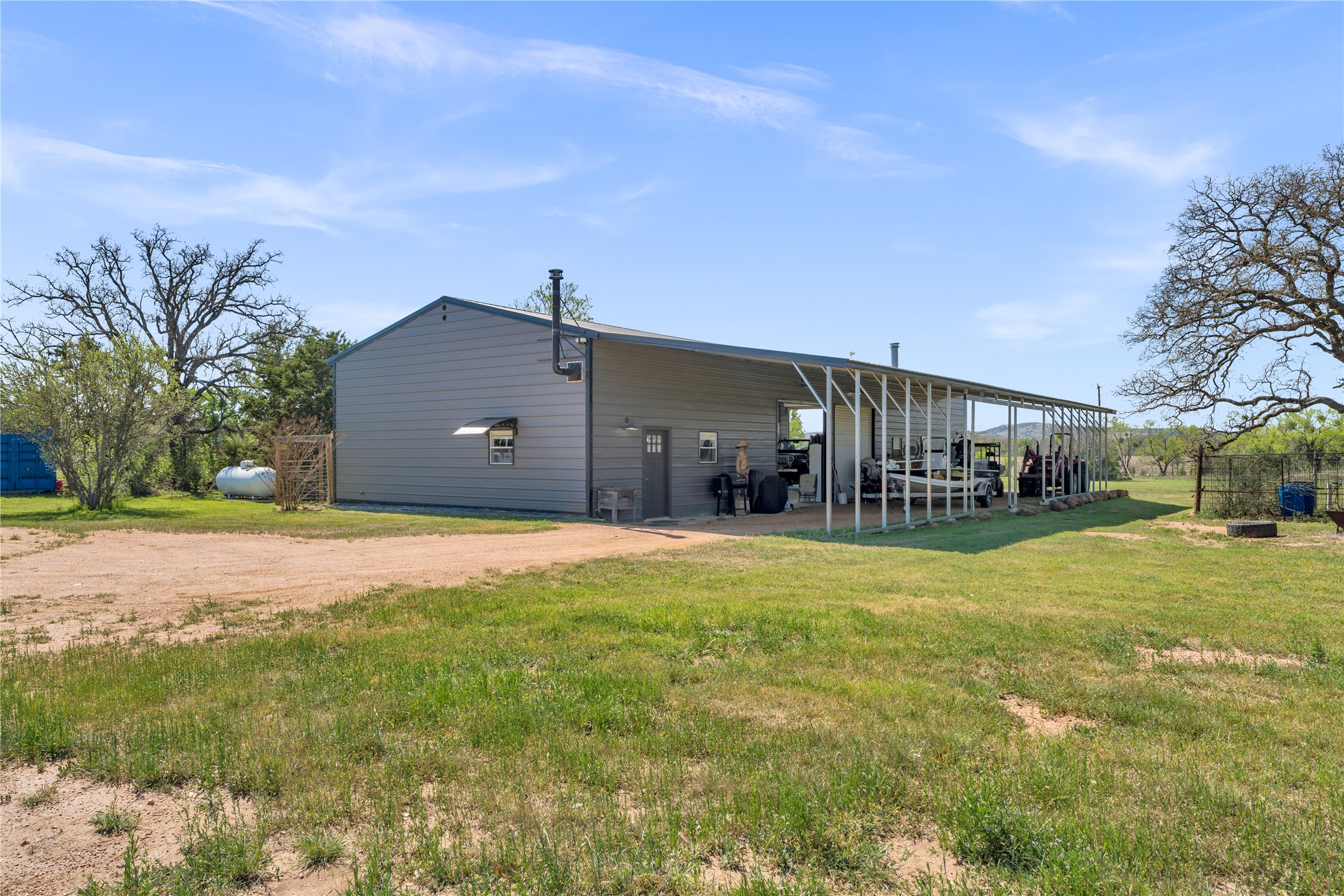 6475 County Road 216 Bluffton, TX 78607 - Photo 15 of 33 a front view of a house with a yard and garage