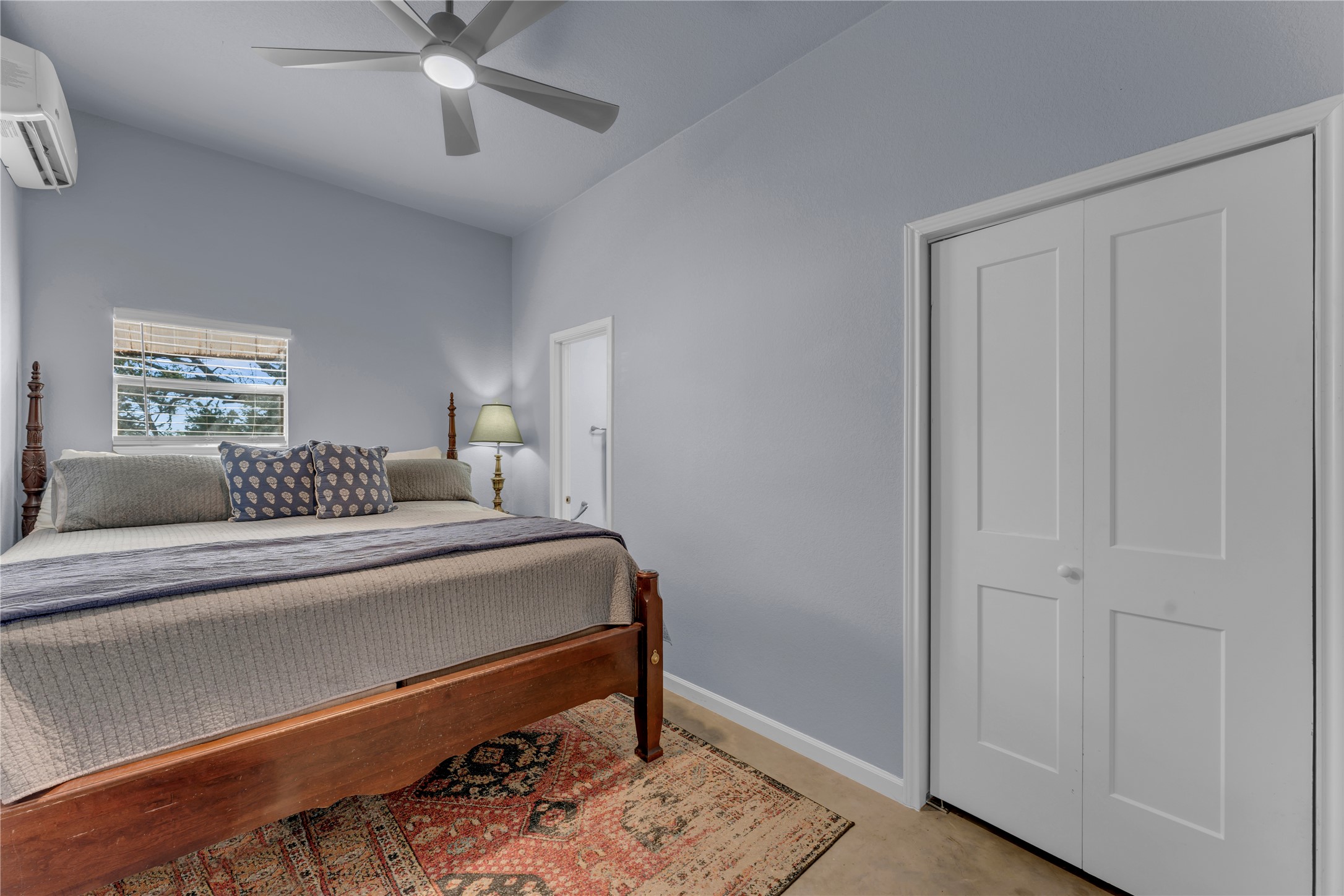 6475 County Road 216 Bluffton, TX 78607 - Photo 28 of 33 a bedroom with a bed and a chandelier