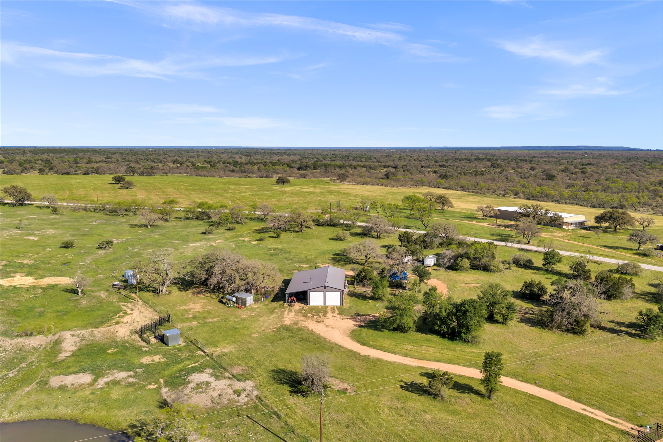 6475 County Road 216 Bluffton, TX 78607 - Photo 9 of 33 an aerial view of residential houses with outdoor space