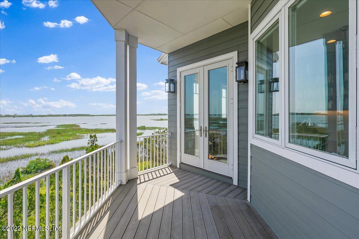 3425 Lands End Drive St. Augustine, FL 32084 - Photo 11 of 79 a view of a balcony with floor to ceiling window wooden floor and outdoor space