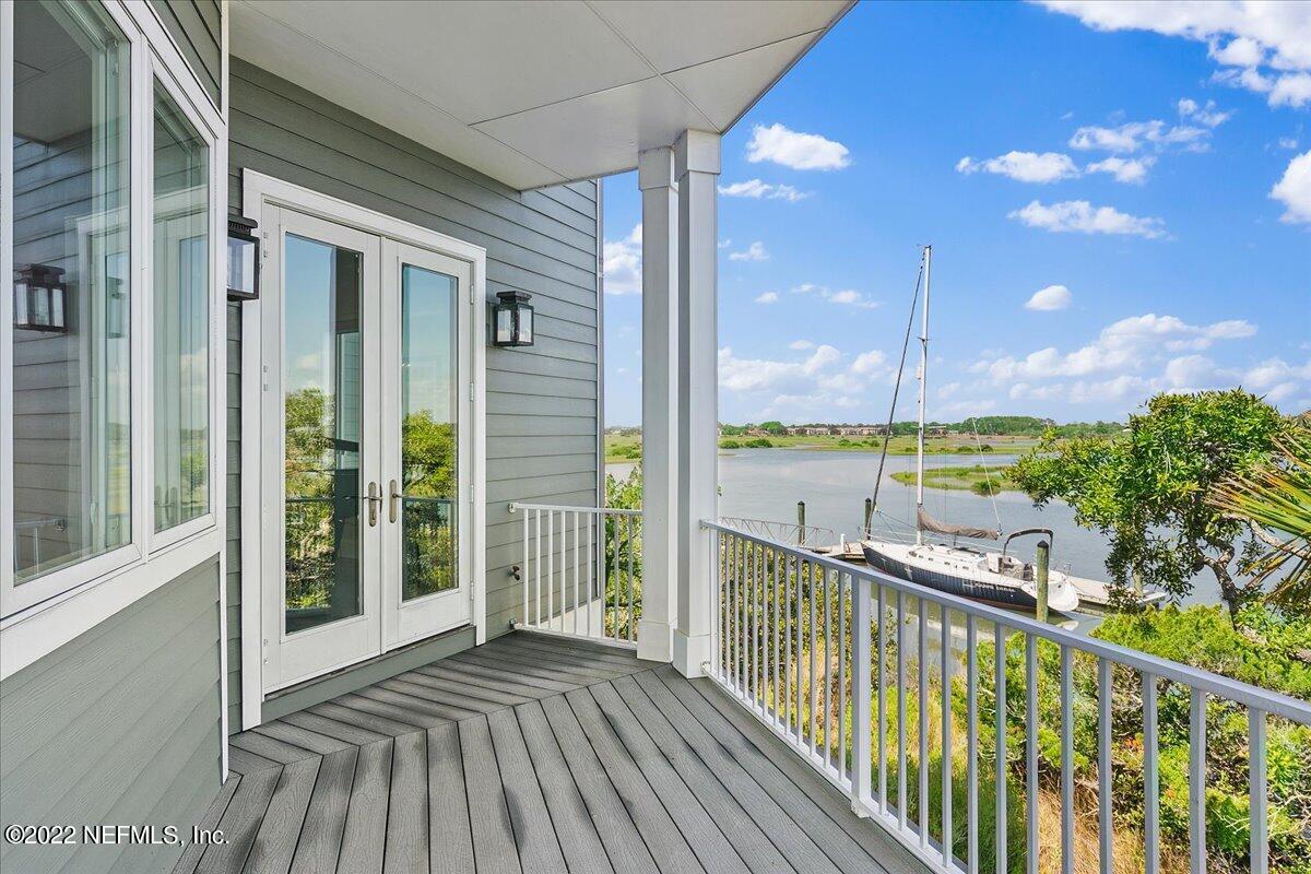 3425 Lands End Drive St. Augustine, FL 32084 - Photo 12 of 79 a view of a balcony with floor to ceiling window wooden floor
