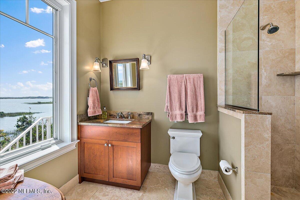3425 Lands End Drive St. Augustine, FL 32084 - Photo 15 of 79 a bathroom with a toilet a sink and a mirror