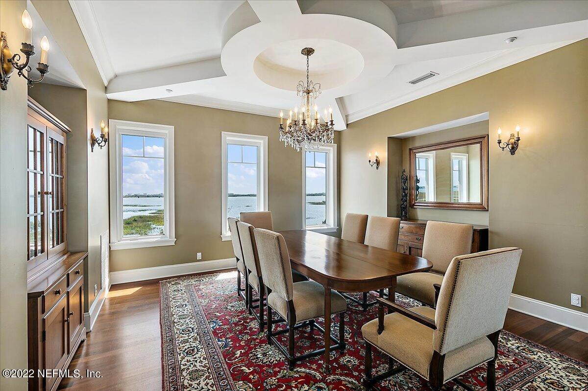 3425 Lands End Drive St. Augustine, FL 32084 - Photo 16 of 79 a view of a dining room with furniture and chandelier