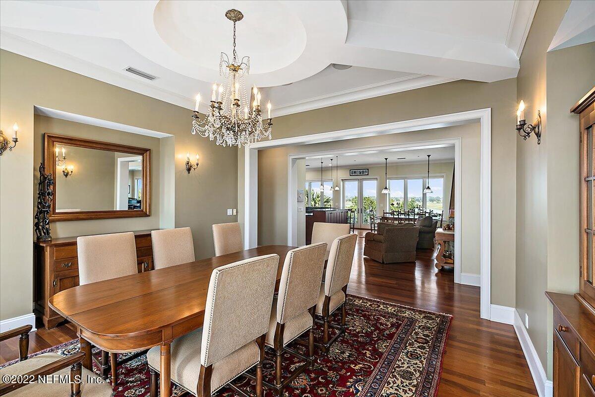 3425 Lands End Drive St. Augustine, FL 32084 - Photo 17 of 79 a view of a dining room with furniture and wooden floor