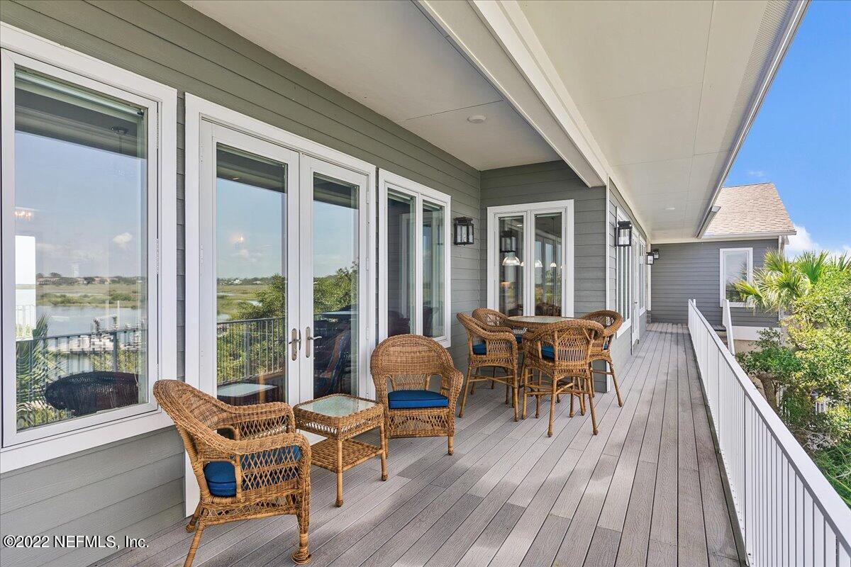 3425 Lands End Drive St. Augustine, FL 32084 - Photo 29 of 79 a balcony with furniture and wooden floor