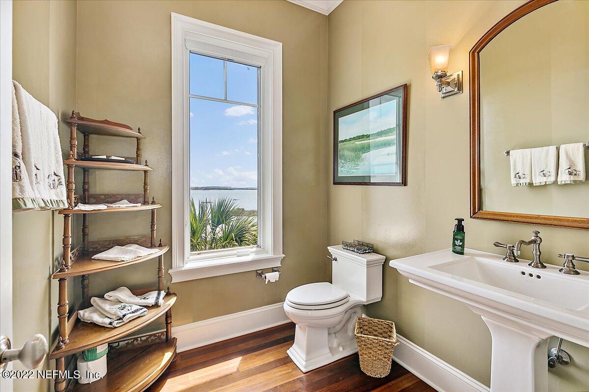 3425 Lands End Drive St. Augustine, FL 32084 - Photo 30 of 79 a bathroom with a sink a toilet and shower curtain