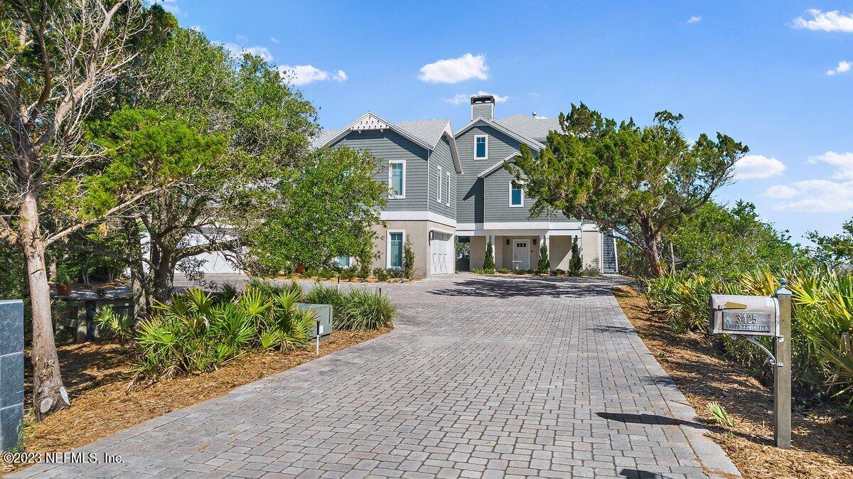 3425 Lands End Drive St. Augustine, FL 32084 - Photo 3 of 79 a front view of a house with a garden