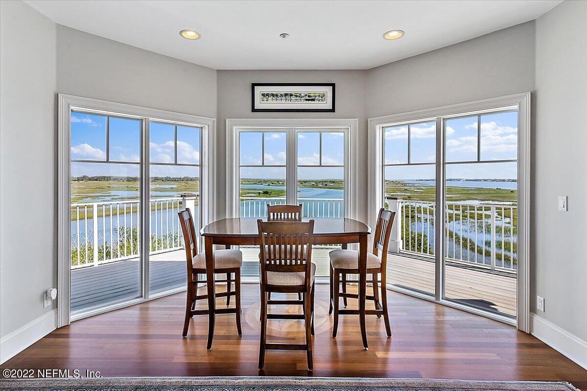 3425 Lands End Drive St. Augustine, FL 32084 - Photo 34 of 79 a view of a dining room with furniture window and wooden floor