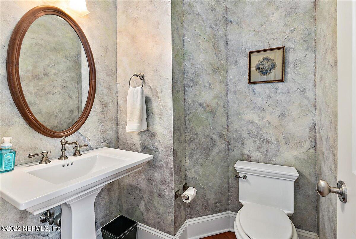 3425 Lands End Drive St. Augustine, FL 32084 - Photo 44 of 79 a bathroom with a toilet a sink and a mirror