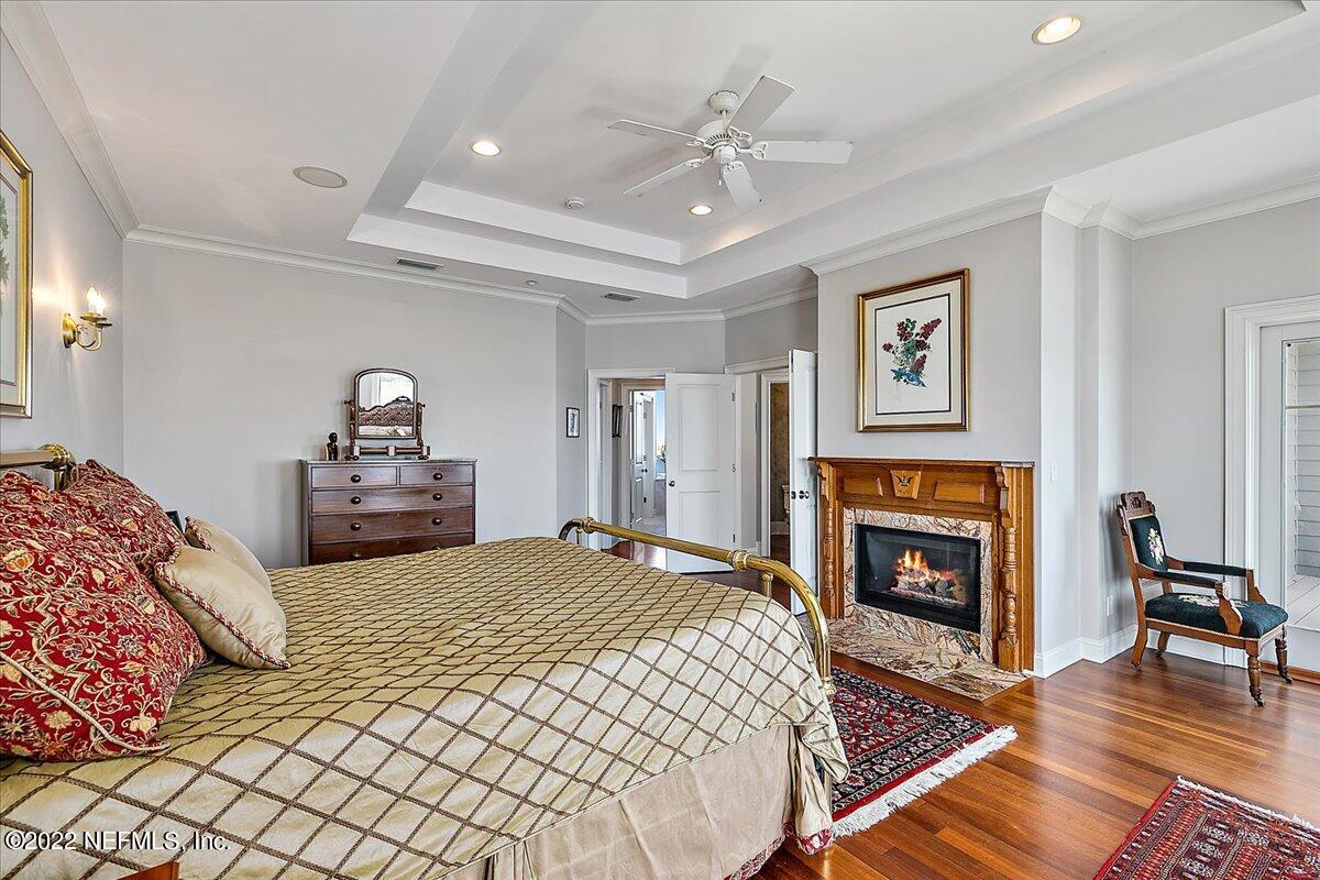 3425 Lands End Drive St. Augustine, FL 32084 - Photo 46 of 79 a bedroom with a bed and a fireplace
