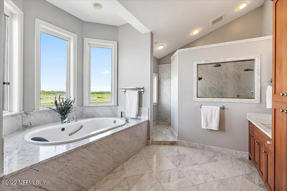 3425 Lands End Drive St. Augustine, FL 32084 - Photo 47 of 79 a spacious bathroom with a tub sink and mirror