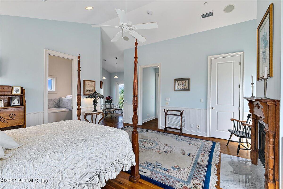3425 Lands End Drive St. Augustine, FL 32084 - Photo 68 of 79 a bedroom with a bed a table and chair