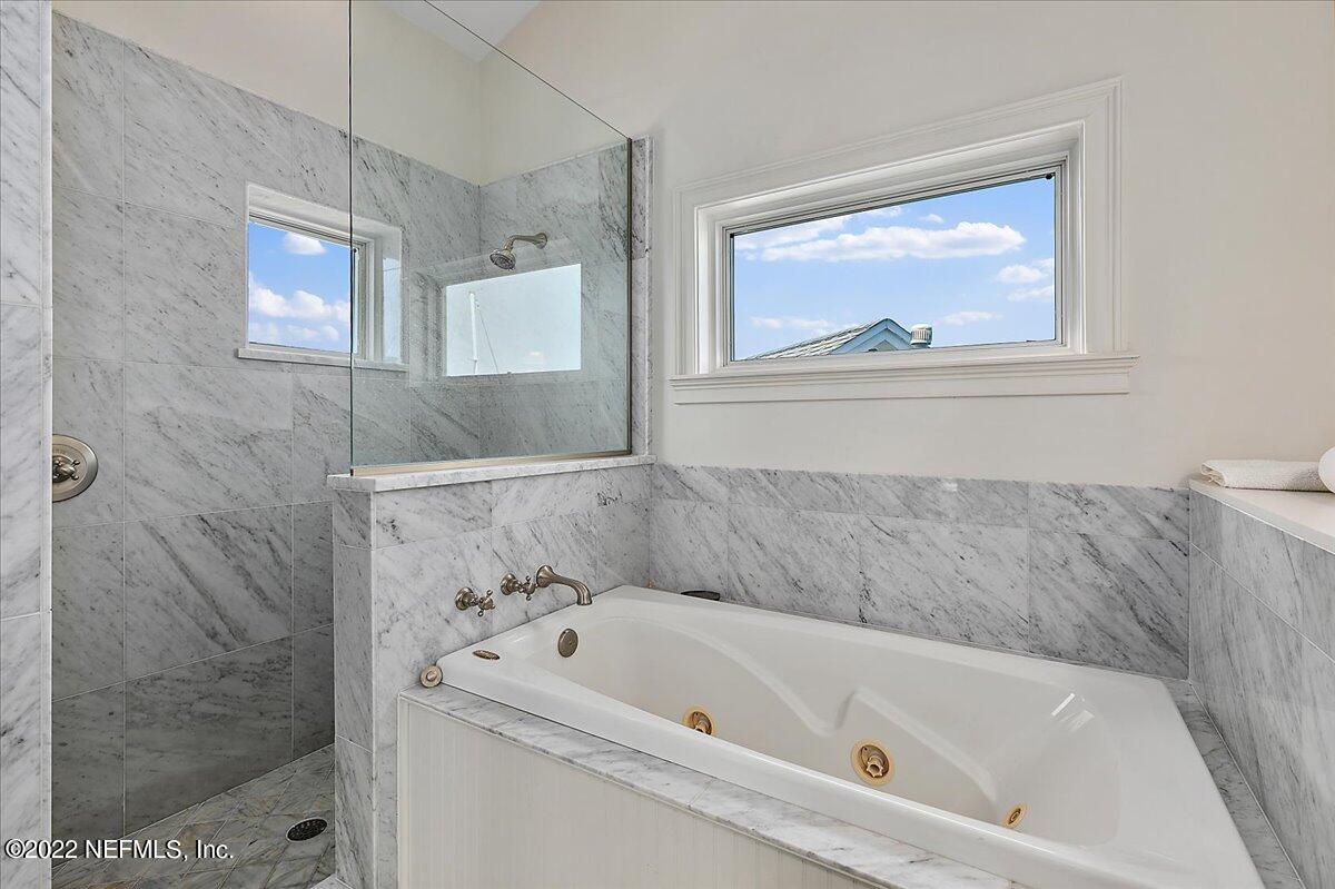 3425 Lands End Drive St. Augustine, FL 32084 - Photo 72 of 79 a bathroom with a bathtub and a shower