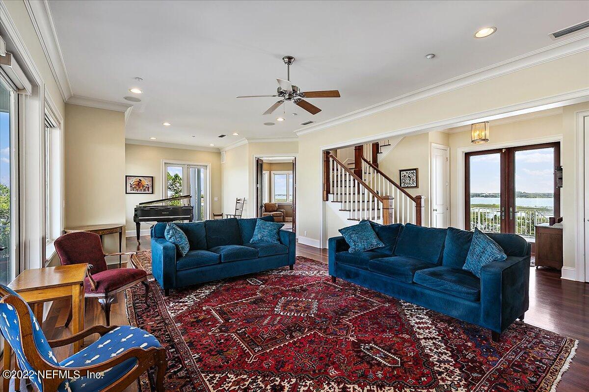 3425 Lands End Drive St. Augustine, FL 32084 - Photo 8 of 79 a living room with furniture ceiling fan and a rug